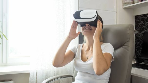 Portrait of beautiful young woman in virtual reality headset - Photo, Image