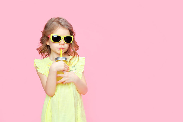Lovely little girl in summer outfit with drink - Fotografie, Obrázek