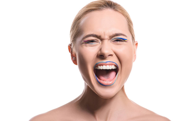 angry woman with colored makeup with lines screaming isolated on white - Фото, зображення