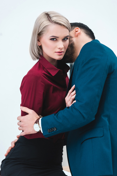seductive young couple of business people kissing and flirting  - Fotoğraf, Görsel