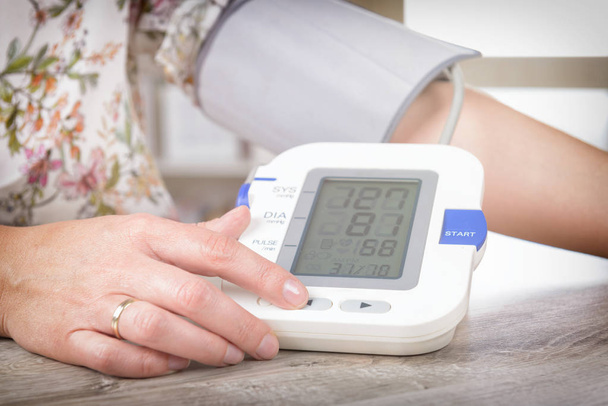 Checking blood pressure at home - Photo, Image
