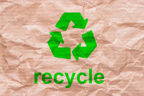 recycle sign on wrapping paper. reuse reduce recycle concept - Foto, imagen
