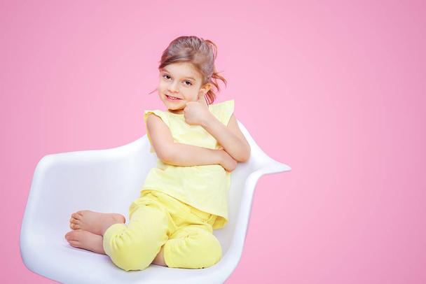 Stylish girl showing thumb up on pink - 写真・画像