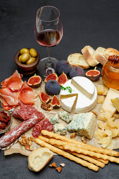 various types of cheese, meat, fruits and wine - Photo, Image
