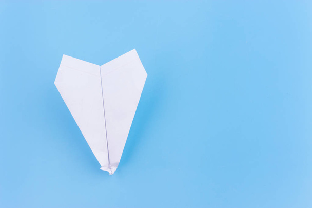 plane crash concept. paper plane upside down on blue background - Fotoğraf, Görsel