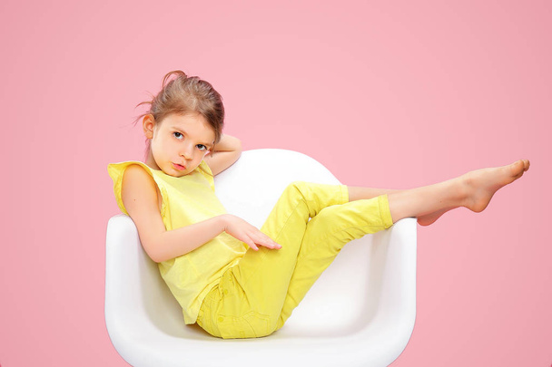 Stylish little girl in yellow n pink - Foto, imagen