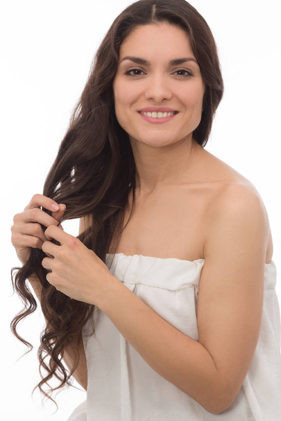 Pretty brunette woman wearing white dress - Photo, image