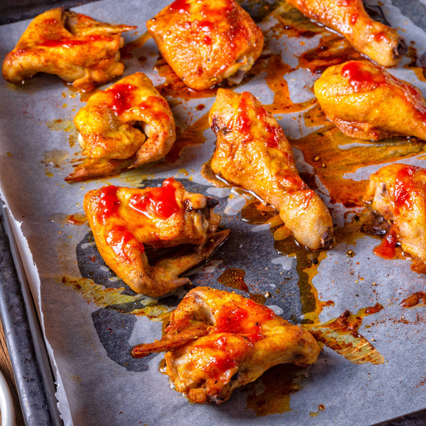 Rustic backed chicken wings,legs on baking tray - Photo, Image