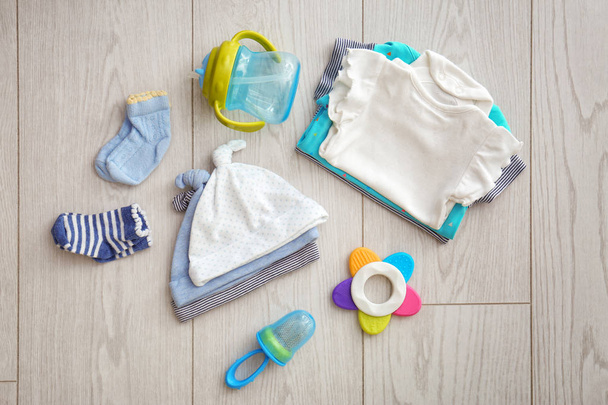 Flat lay composition with fashionable children's clothes on wooden background - Fotoğraf, Görsel