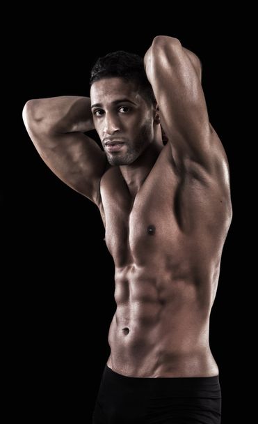 muscled man on a black background - Photo, image