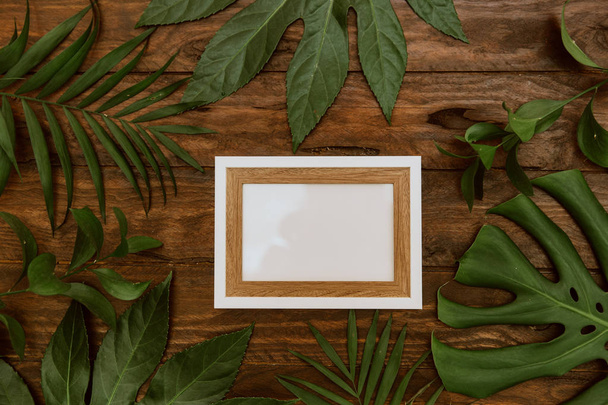 Flat lay tropical mock up with leaves - Fotoğraf, Görsel