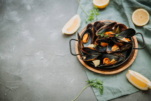 Boiled mussels  on  table. Top view. - Foto, afbeelding