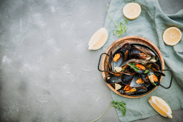 Boiled mussels  on  table. Top view. - Foto, afbeelding
