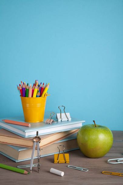 Back to school concept with school supplies. Colorful pencils, books with copy space - Foto, imagen