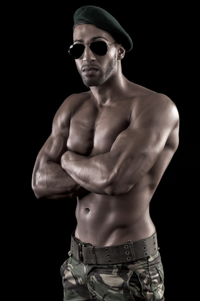 muscled man on a black background - Фото, зображення