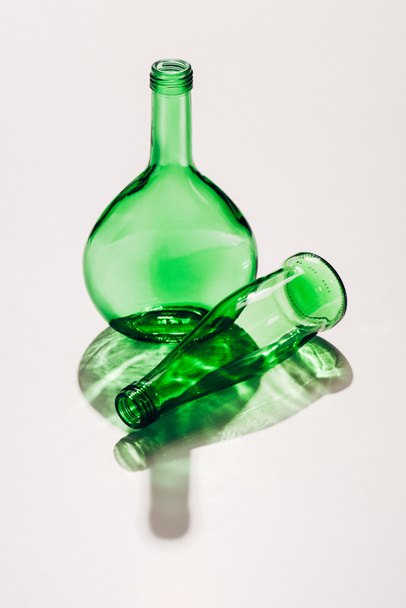 close up view of empty green glassware on whit ebackdrop - 写真・画像