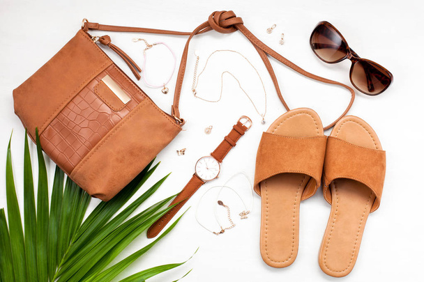 Summer street style. Fashion summer girl clothes set, accessories. Trendy sunglasses,  handbag clutch, necklace hat. Summer lady. Creative urban overhead summer top view - Photo, Image