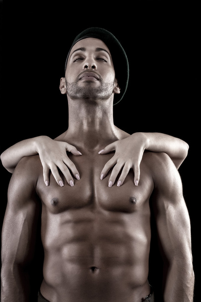 muscled man on a black background - Φωτογραφία, εικόνα