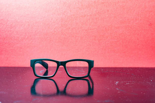 Conceptual photograph of life, spectacles with matte black frame - Фото, зображення