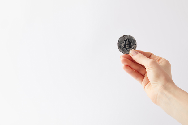 cropped shot of woman holding bitcoin isolated on white - Zdjęcie, obraz