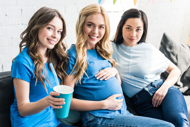 multicultural friends with drink and pregnant woman looking at camera at baby-party - Фото, зображення