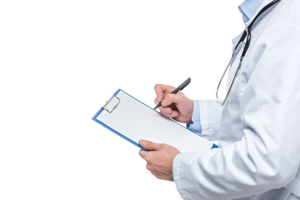 cropped image of male doctor writing diagnosis in clipboard isolated on white background - Photo, Image