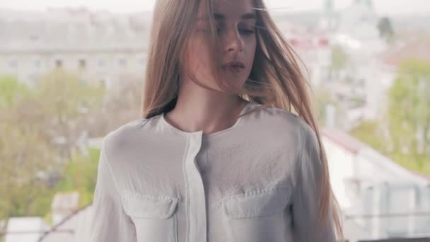Summer lifestyle fashion portrait of young beautiful blonde stylish hipster woman wearing white shirt - Footage, Video