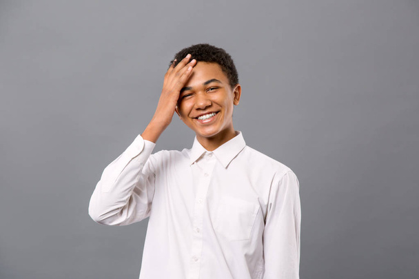 Delighted young man touching his forehead - Photo, Image