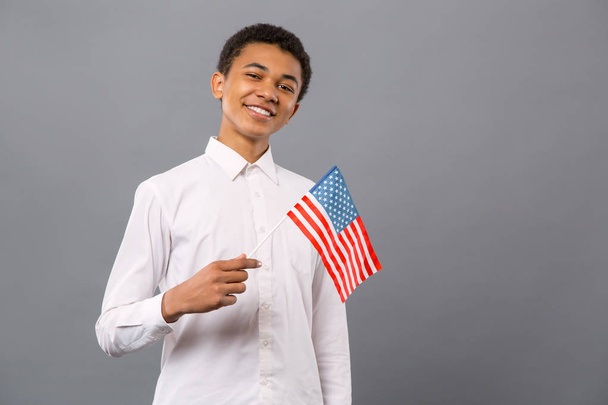 Joyful young man being proud of his country - Фото, зображення