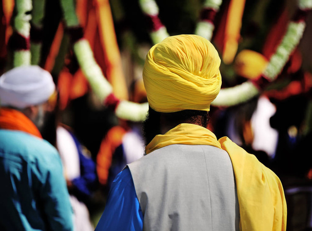 Sikh man with yellow turban and long black beard - Photo, Image
