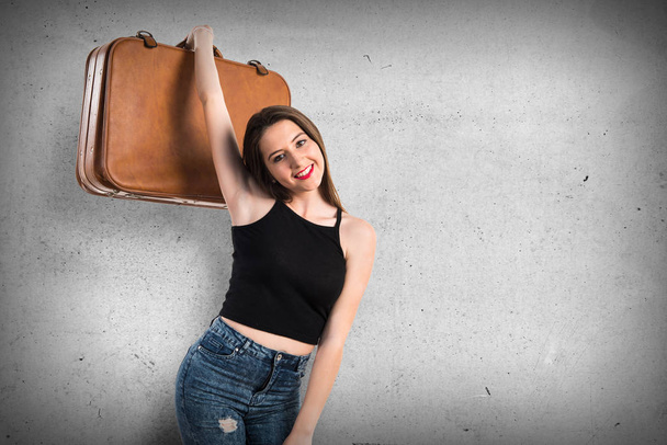 Young girl holding a briefcase - Photo, Image