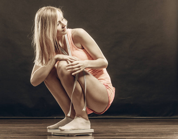 gym woman on weight scale - Valokuva, kuva