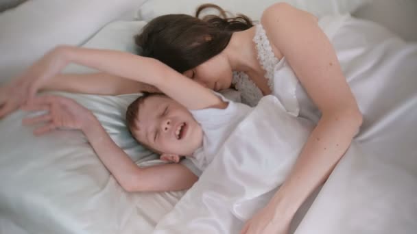 Mom and son wake up together. - Footage, Video