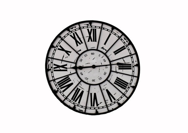 Vintage wall clock is isolated on white background with clipping path, roman numbers are hour and arabic numerals are minute. This time is nine and fourteen minute. - Photo, Image