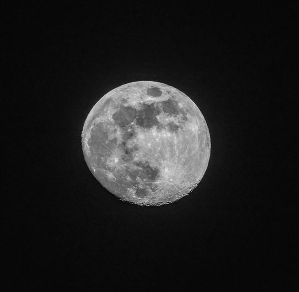 full moon up close in a black night sky - Photo, Image