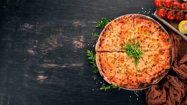 Pizza formaggi. Mozzarella, parmesan cheese. Top view. On a wooden background. Copy space. - Φωτογραφία, εικόνα