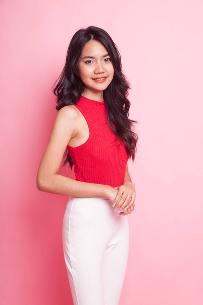 Portrait of beautiful young Asian woman in red shirt. - 写真・画像