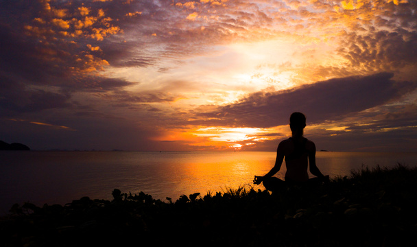 Serenity and yoga practicing at sunset,meditation - Photo, Image