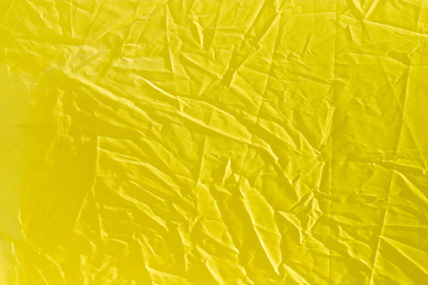 wrinkled yellow cloth as background - Foto, imagen
