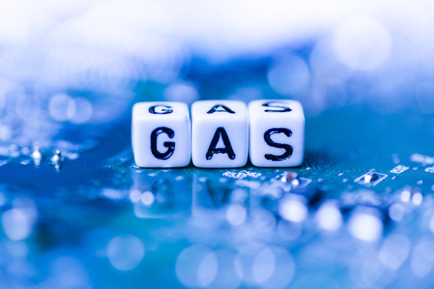Word GAS formed by alphabet blocks on mother cryptocurrency - Photo, Image