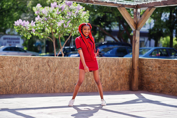 Cute and slim african american girl in red dress with dreadlocks - Foto, Imagem