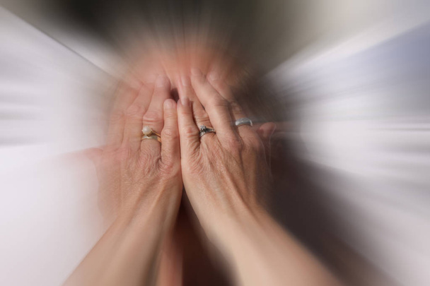 Close up portrait of woman covering her face with hands in blurred background. Sex concept. Focus on woman hand. Rape and sexual abuse. Stop violence against women, concept photo of Sexual assault - Фото, зображення