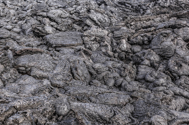 stenen van vulkanische stromen geven een prachtige natuurlijke structuur - Foto, afbeelding