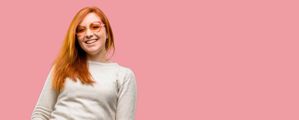 Beautiful young redhead woman confident and happy with a big natural smile laughing, natural expression - Foto, afbeelding