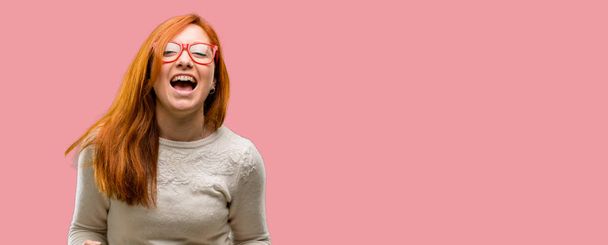 Beautiful young redhead woman happy and excited celebrating victory expressing big success, power, energy and positive emotions. Celebrates new job joyful - Foto, imagen