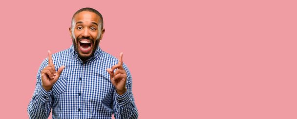 African american man with beard pointing away side with finger - Foto, Imagen