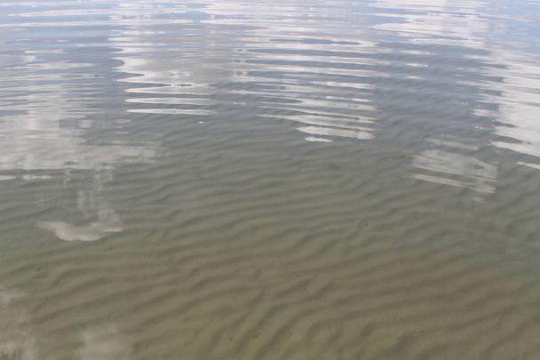 the sand on the beach under water, deserted beach lake, summer, sunlight on the sand - Photo, Image
