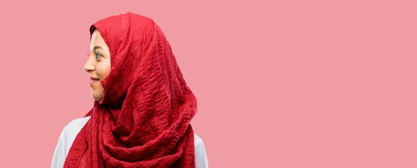 Young arab woman wearing hijab side view portrait - Photo, Image