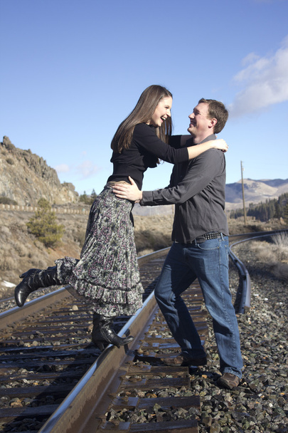 Couple on the train tracks - Photo, Image