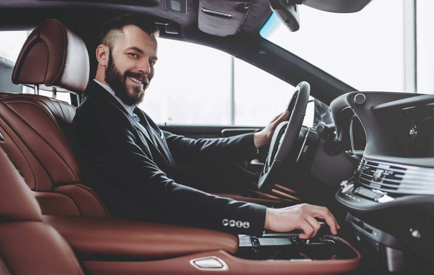 Businessman in car - Фото, изображение